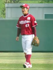 西巻賢二